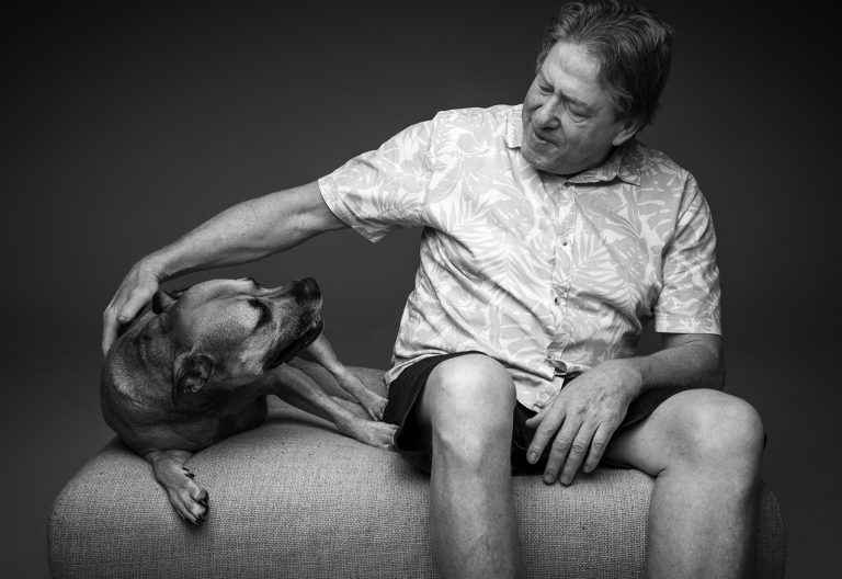 man and is dog in family photography