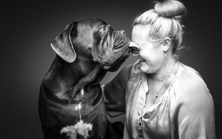 dog licking womans face in pet photography Gold Coast