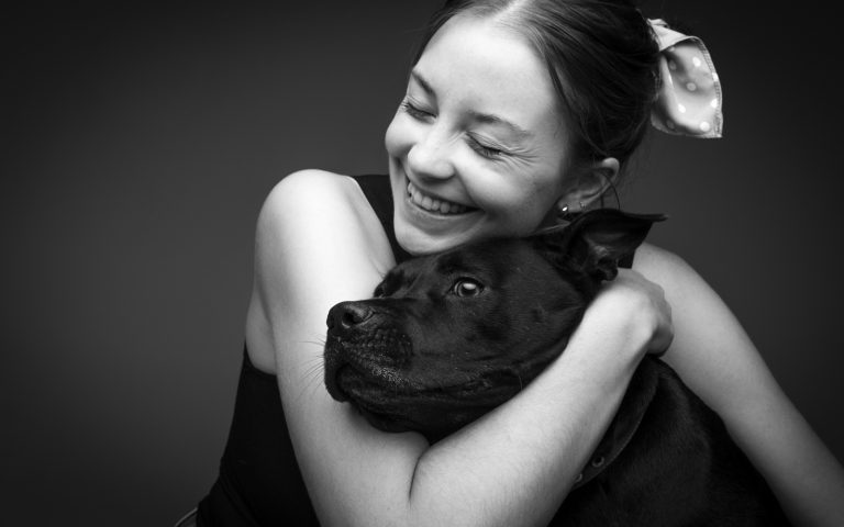girl huggling dog in photography session